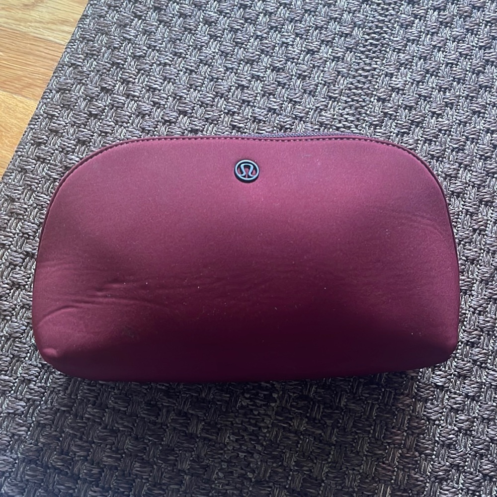 Lululemon burgundy makeup bag.